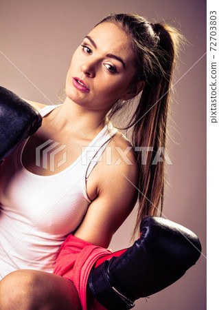 Feminist woman training, boxing. 72703803