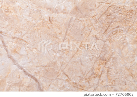 Texture of decorative beige plaster imitating the old peeling stone wall. 72706002