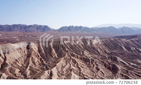 Stony hills of dark color in the steppe. Stony hills of dark color in the steppe. 72706238