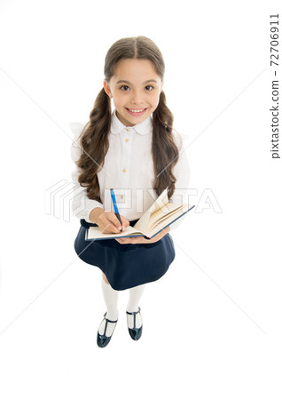 Writing essay. Girl with copy book or workbook. Kid 72706911