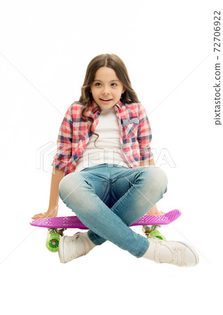 Sit and relax. Kid girl relaxed sits penny board. Learning  72706922