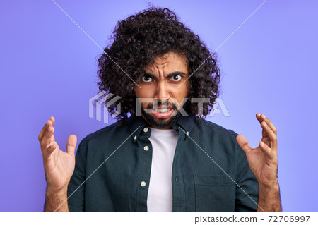 angry male is tired of enduring such behavior, looks at camera irritated 72706997