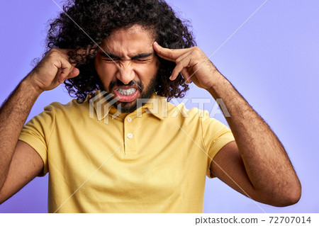 young arabic male has headache isolated 72707014
