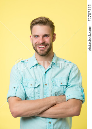 Cheerful consultant. Man smiling face posing confidently 72707335