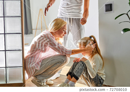 caucasian woman with a child endure her husband's disgusting behavior in the house caucasian woman with a child endure her husband's disgusting behavior in the house 72708010