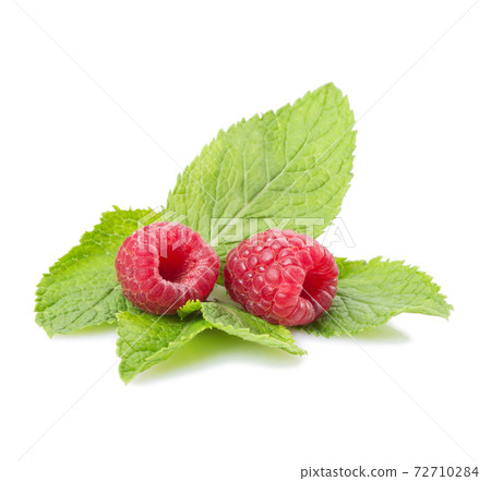 Raspberries and mint leaves on a white background. Isolated Raspberries and mint leaves on a white background. Isolated 72710284