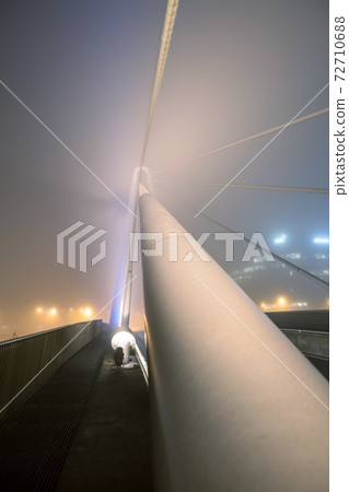bridge over water whit fog 72710688