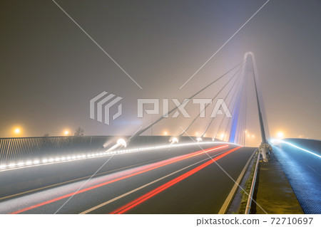 bridge over water whit fog 72710697