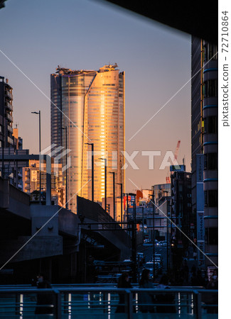 Tokyo cityscape of Japan Winter solstice. View of Roppongi Hills, which is dyed orange in the setting sun from Shibuya = December 21st Tokyo cityscape of Japan Winter solstice. View of Roppongi Hills, which is dyed orange in the setting sun from Shibuya = December 21st 72710864
