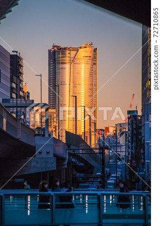 Tokyo cityscape of Japan Winter solstice. View of Roppongi Hills, which is dyed orange in the setting sun from Shibuya = December 21st 72710865