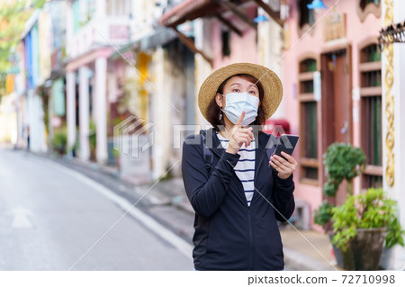 Travelers on street Phuket old town with Building Sino Portuguese architecture at Phuket Old Town area Phuket, Thailand. Travel concept 72710998