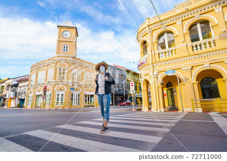 Travelers on street Phuket old town with Building Sino Portuguese architecture at Phuket Old Town area Phuket, Thailand. Travel concept 72711000