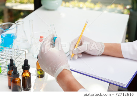 Researcher or scientists working in laboratory. Researcher or scientists working in laboratory. 72712616