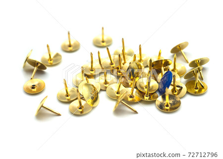 Closeup of golden paper pins on white background 72712796