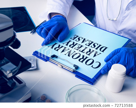The medic reads about Coronary artery disease CAD. The medic reads about Coronary artery disease CAD. 72713588