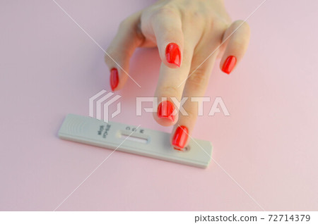 Positive test result by using rapid test for COVID-19, quick fast antibody point of care testing. Lab performing rapid diagnostic test for antibodies to detect presence of antigens COVID-19 disease 72714379