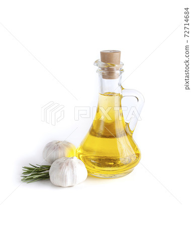 Rosemary twig and garlic, olive oil on bottle isolated on white background. 72714684