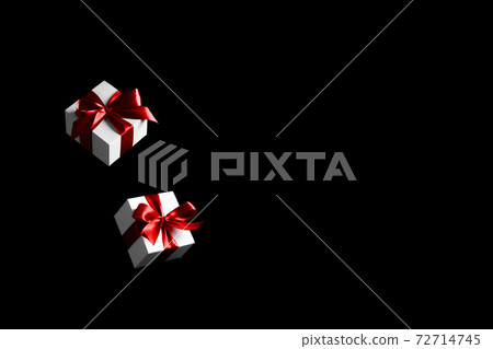 Sale background black. White gifts with red bow falling on dark background for Black Friday banner. Flying backdrop with space for text. 72714745