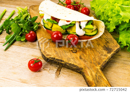 Chicken stuffed shawarma tortilla tacos wraps doner kebab sandwich gyros fast food with vegetables Chicken stuffed shawarma tortilla tacos wraps doner kebab sandwich gyros fast food with vegetables 72715042