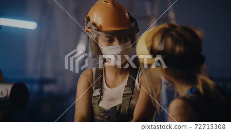Professional female workers on industrial manufacture Professional female workers on industrial manufacture 72715308