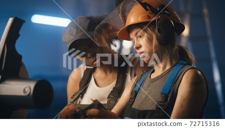 Professional female workers on industrial manufacture Professional female workers on industrial manufacture 72715316