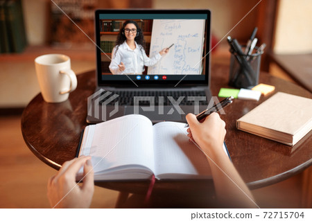 Student using laptop having online class with teacher, pov Student using laptop having online class with teacher, pov 72715704