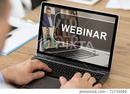 Unrecognizable man having webinar on laptop while working in office 72716066