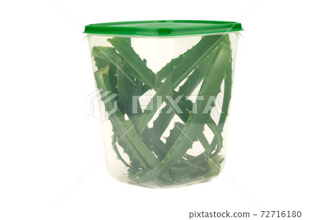 Chopped aloe cactus leaves in a plastic container. Chopped aloe cactus leaves in a plastic container. 72716180