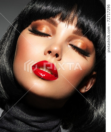 Beautiful brunette girl with red lips and black bob hairstyle. Pretty young woman with closed eyes. Closeup portrait of a model with bright makeup on a face. Fashion portrait of a pretty lady. Beautiful brunette girl with red lips and black bob hairstyle. Pretty young woman with closed eyes. Closeup portrait of a model with bright makeup on a face. Fashion portrait of a pretty lady. 72717296