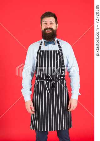 Hipster cafe concept. Man with beard cook hipster apron.  72720389