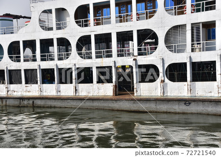 Ferry retro hull and guest rooms parked at Shodol Gat at Dhaka, Bangladesh 72721540