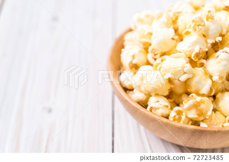 sweet popcorn on wood 72723485