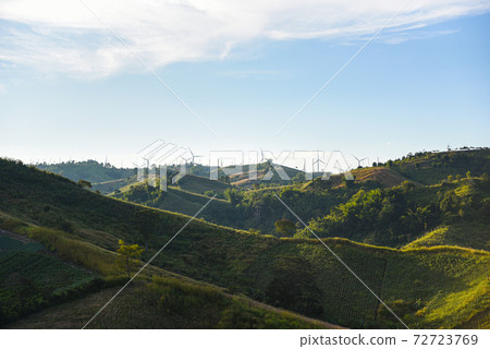 wind turbine landscape natural energy green Eco power concept at wind turbines farm blue sky background. 72723769