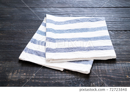 kitchen cloth (napkin) on wood background kitchen cloth (napkin) on wood background 72723848