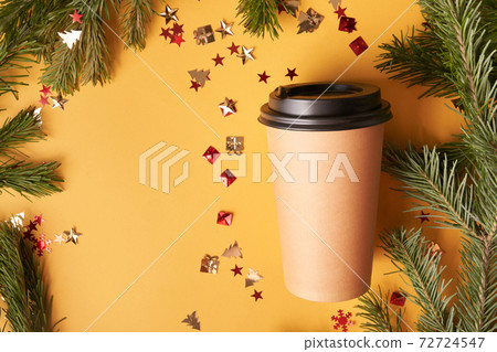 Coffee paper cup on yellow background with confetti and fur, Christmas mockup  72724547