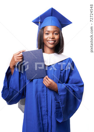 Black woman in a blue robe on a white background smiles and shows diploma 72724548