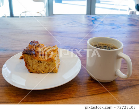 Close up shot of a cake and a coffee Close up shot of a cake and a coffee 72725105