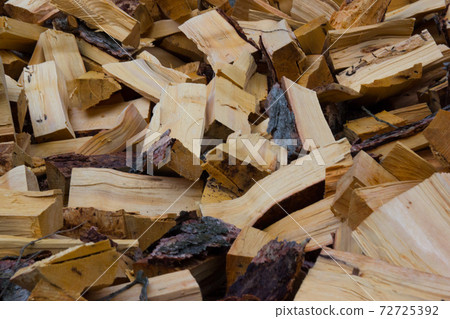 A large mountain of firewood in the village. Preparation for winter. A large mountain of firewood in the village. Preparation for winter. 72725392