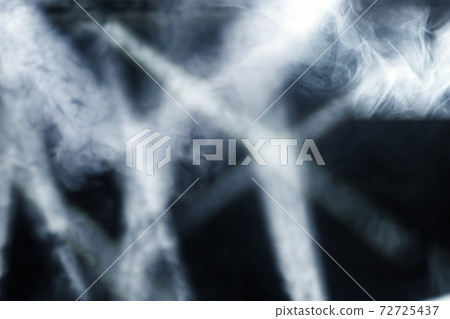 Ray of light with smoke and fog spotlights on the stage. Scene light equipment. 72725437