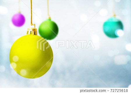 Colorful Christmas ball hanging with blurred light background Colorful Christmas ball hanging with blurred light background 72725618