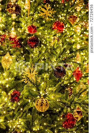 Christmas trees and sparkling decorations that brightly illuminate a happy Christmas 72726456