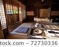 Japanese house with a hearth where the setting sun shines 72730336