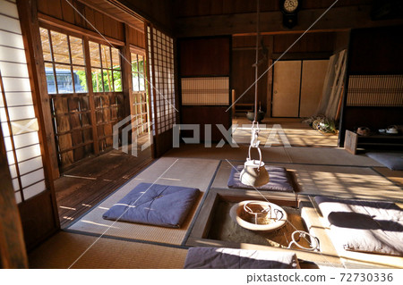 Japanese house with a hearth where the setting sun shines 72730336