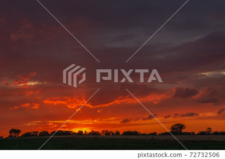 Beautiful fiery sky and clouds during sunset 72732506