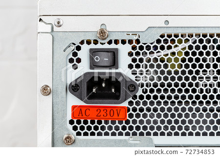 Rear view of tower computer case with new power supply unit installed. Rear view of tower computer case with new power supply unit installed. 72734853