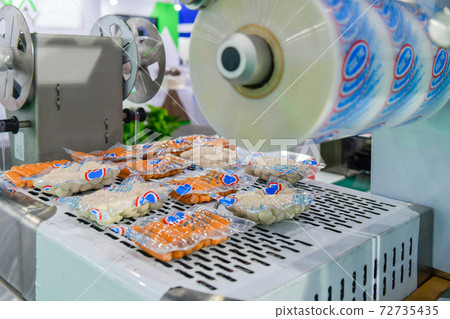 Automatic food production line on conveyor belt equipment machinery in factory, industrial food production Automatic food production line on conveyor belt equipment machinery in factory, industrial food production 72735435