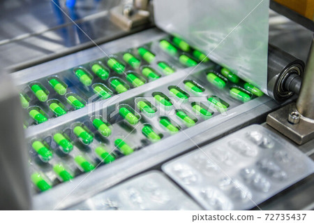 Green capsule medicine pill production line, Industrial pharmaceutical concept 72735437