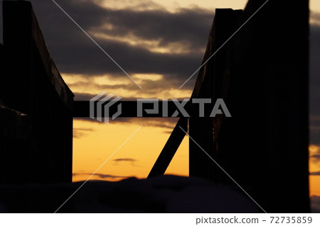 Playground equipment and sunset Playground equipment and sunset 72735859