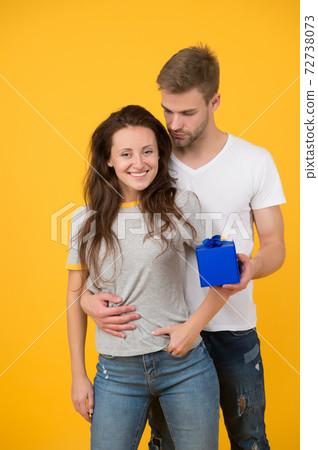 Pack your present in box. Happy couple hold gift box.  72738073