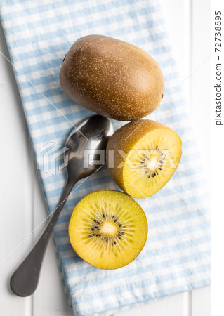 Halved ripe yellow kiwi fruit. Halved ripe yellow kiwi fruit. 72738895